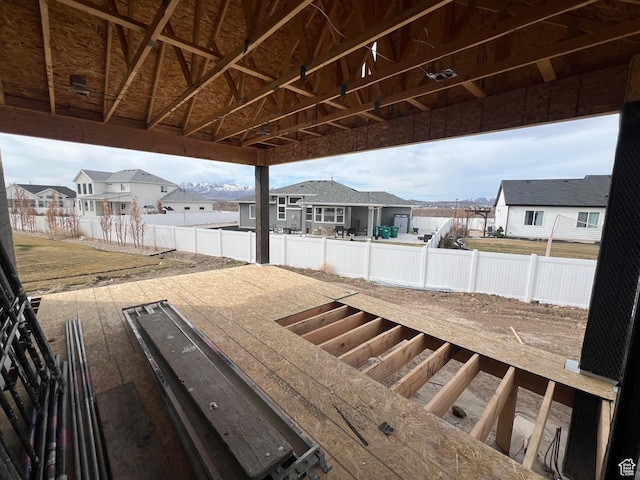 exterior space featuring fence and a residential view