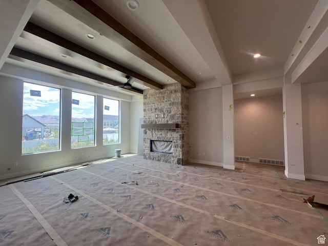 1185 N 2650 W, Lehi, UT 84043 - unfurnished living room with beamed ceiling, a fireplace, and recessed lighting