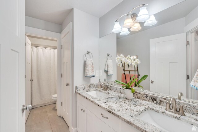 11702 S Water Brook Ct, South Jordan, UT 84095 - bathroom with tile patterned flooring, a notable chandelier, toilet, and a sink