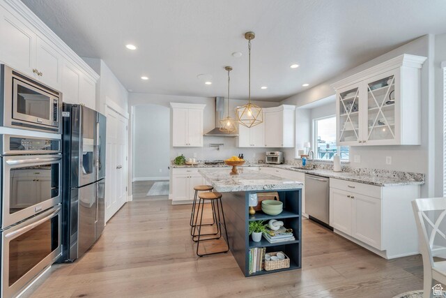 11702 S Water Brook Ct, South Jordan, UT 84095 - kitchen featuring open shelves, wall chimney range hood, white cabinets, and appliances with stainless steel finishes