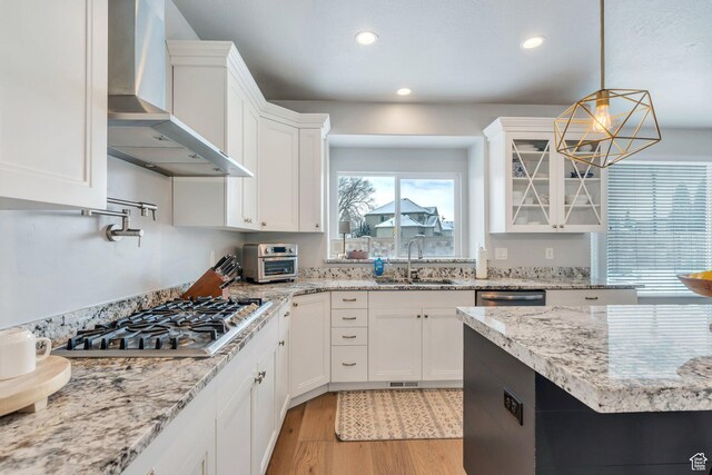 11702 S Water Brook Ct, South Jordan, UT 84095 - kitchen with a sink, light wood-style floors, appliances with stainless steel finishes, wall chimney exhaust hood, and white cabinets