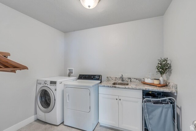 11702 S Water Brook Ct, South Jordan, UT 84095 - washroom with washer and clothes dryer, cabinet space, baseboards, and a sink