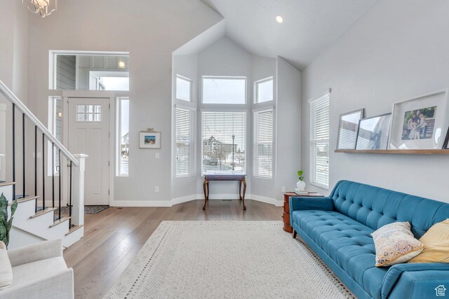 11702 S Water Brook Ct, South Jordan, UT 84095 - living room featuring stairway, high vaulted ceiling, baseboards, and wood finished floors