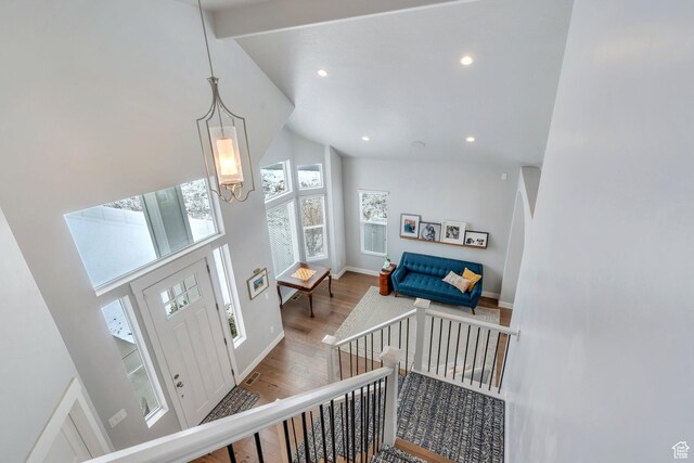 11702 S Water Brook Ct, South Jordan, UT 84095 - entryway featuring recessed lighting, high vaulted ceiling, an inviting chandelier, and wood finished floors