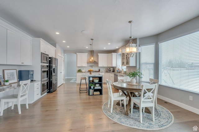 11702 S Water Brook Ct, South Jordan, UT 84095 - dining room featuring light wood finished floors, visible vents, recessed lighting, and baseboards