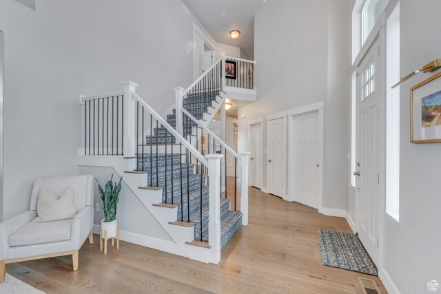 11702 S Water Brook Ct, South Jordan, UT 84095 - entrance foyer featuring stairway, wood finished floors, and baseboards