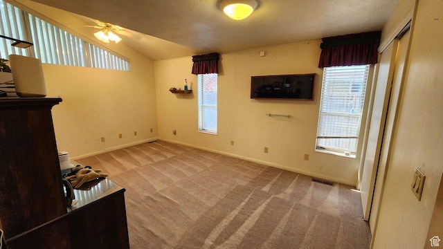 1981 W 3825 S, Roy, UT 84067 - unfurnished living room with baseboards, ceiling fan, carpet flooring, and visible vents