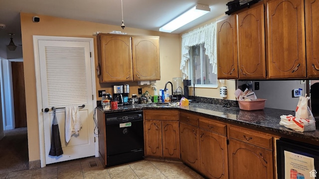 1981 W 3825 S, Roy, UT 84067 - kitchen with brown cabinetry, black dishwasher, and a sink