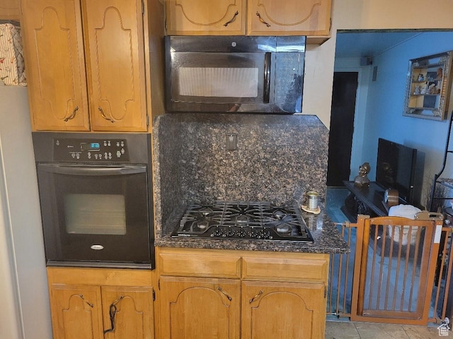 1981 W 3825 S, Roy, UT 84067 - kitchen with black appliances, dark stone countertops, and brown cabinets