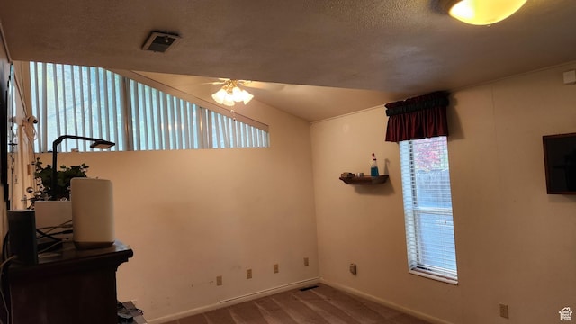 1981 W 3825 S, Roy, UT 84067 - interior space featuring baseboards, visible vents, ceiling fan, and a textured ceiling
