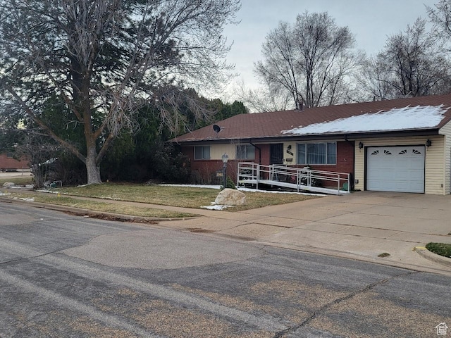 1981 W 3825 S, Roy, UT 84067 - ranch-style home featuring driveway, brick siding, a garage, a front yard, and a porch