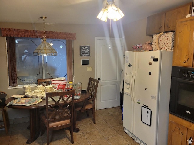 1981 W 3825 S, Roy, UT 84067 - dining area featuring a ceiling fan and light tile patterned flooring