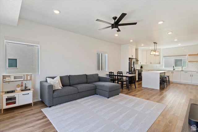 51 E Vantage Dr, North Salt Lake, UT 84054 - living room with a ceiling fan, light wood finished floors, and recessed lighting