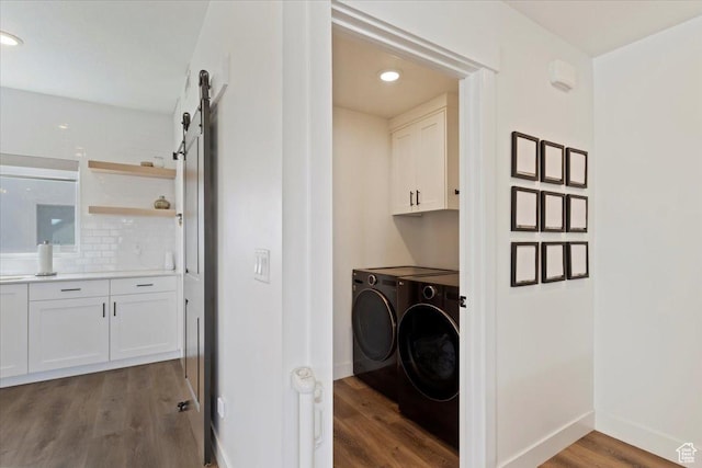 51 E Vantage Dr, North Salt Lake, UT 84054 - washroom featuring separate washer and dryer, cabinet space, wood finished floors, a barn door, and baseboards