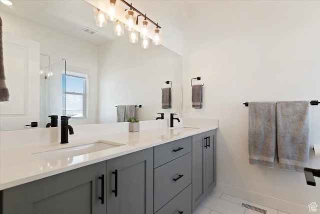 51 E Vantage Dr, North Salt Lake, UT 84054 - full bathroom with double vanity, baseboards, tile patterned floors, and a shower