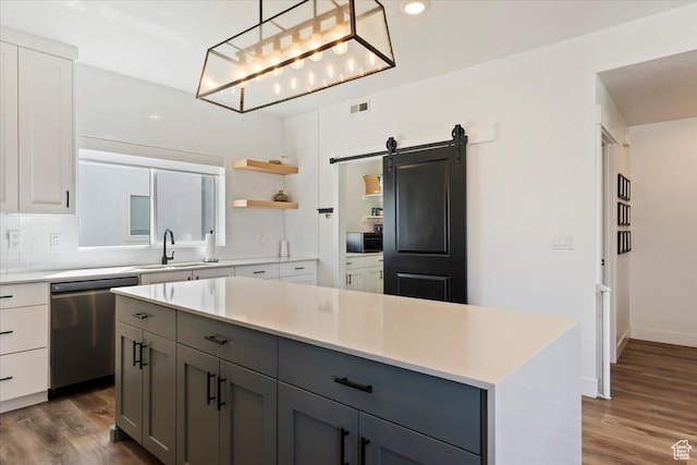 51 E Vantage Dr, North Salt Lake, UT 84054 - kitchen with stainless steel dishwasher, a sink, gray cabinetry, backsplash, and dark wood-style flooring