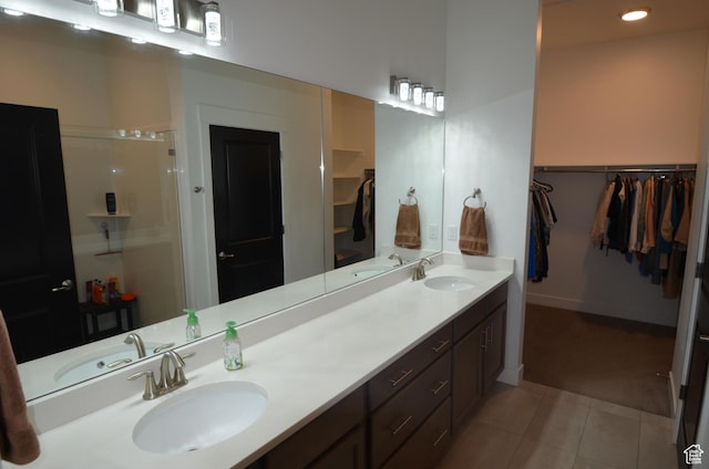 10717 S Haven Vista Dr, South Jordan, UT 84095 - full bathroom with tile patterned flooring, a spacious closet, and a sink