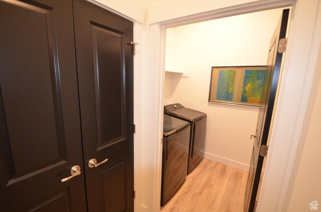 10717 S Haven Vista Dr, South Jordan, UT 84095 - clothes washing area with laundry area, light wood-style flooring, baseboards, and separate washer and dryer
