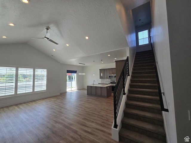 10717 S Haven Vista Dr, South Jordan, UT 84095 - staircase with a textured ceiling, wood finished floors, recessed lighting, baseboards, and ceiling fan