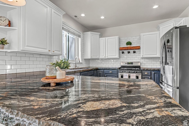 3857 S Windlass Rd W, Saratoga Springs, UT 84045 - kitchen with visible vents, open shelves, white cabinetry, tasteful backsplash, and appliances with stainless steel finishes