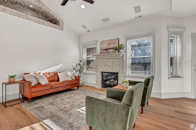 3857 S Windlass Rd W, Saratoga Springs, UT 84045 - living room featuring ceiling fan, visible vents, lofted ceiling, and light wood-style floors