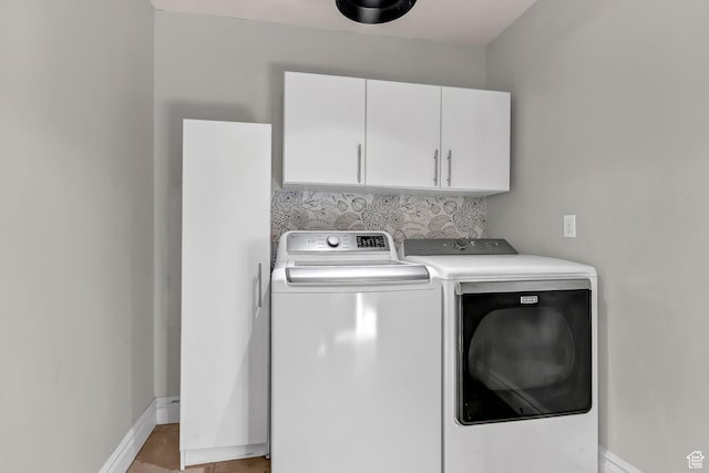 3857 S Windlass Rd W, Saratoga Springs, UT 84045 - washroom featuring baseboards, cabinet space, and washing machine and clothes dryer