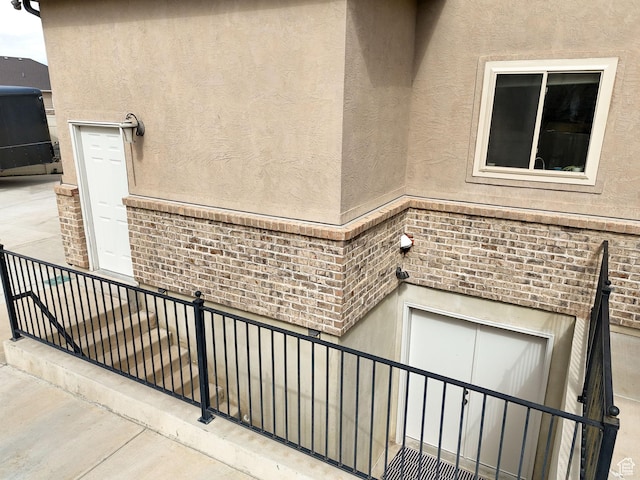 3857 S Windlass Rd W, Saratoga Springs, UT 84045 - doorway to property featuring stucco siding and brick siding