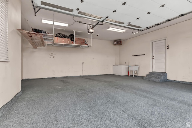 3857 S Windlass Rd W, Saratoga Springs, UT 84045 - garage featuring a sink and a garage door opener