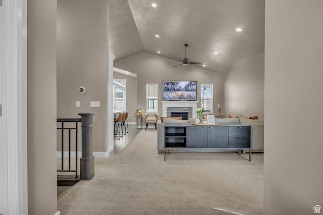 571 S 3350 W, Syracuse, UT 84075 - carpeted living room featuring recessed lighting, a fireplace, baseboards, ceiling fan, and vaulted ceiling