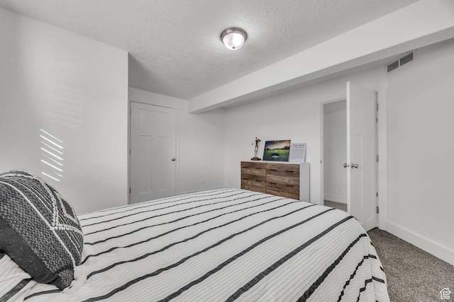 571 S 3350 W, Syracuse, UT 84075 - bedroom featuring visible vents, a textured ceiling, baseboards, and carpet floors