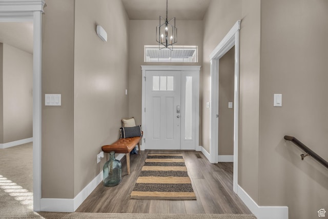 571 S 3350 W, Syracuse, UT 84075 - foyer featuring baseboards, an inviting chandelier, and wood finished floors