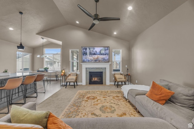 571 S 3350 W, Syracuse, UT 84075 - living area with baseboards, lofted ceiling, recessed lighting, ceiling fan, and a glass covered fireplace