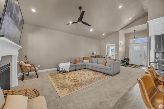 571 S 3350 W, Syracuse, UT 84075 - living room with baseboards, ceiling fan, light colored carpet, lofted ceiling, and a fireplace