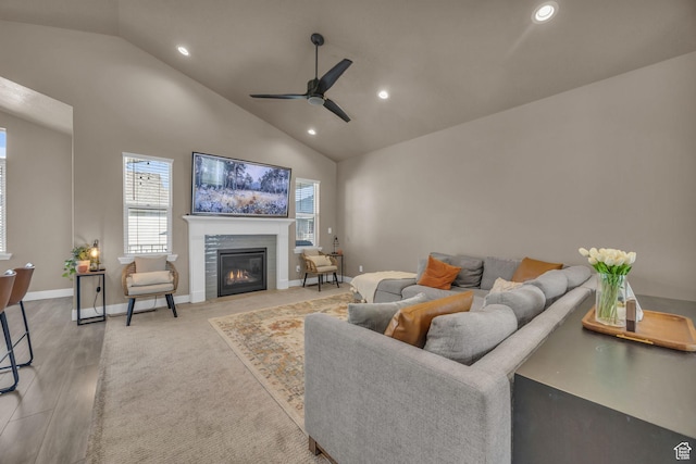 571 S 3350 W, Syracuse, UT 84075 - living area with high vaulted ceiling, a ceiling fan, a tiled fireplace, recessed lighting, and baseboards
