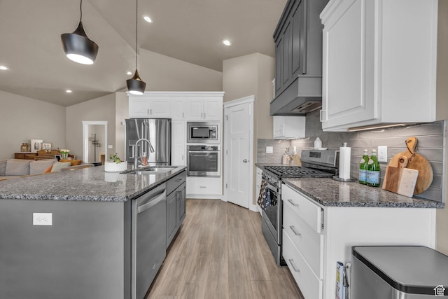 571 S 3350 W, Syracuse, UT 84075 - kitchen with light wood-type flooring, vaulted ceiling, stainless steel appliances, wall chimney exhaust hood, and a sink