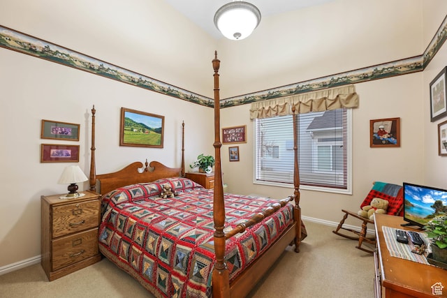 bedroom featuring baseboards and light colored carpet