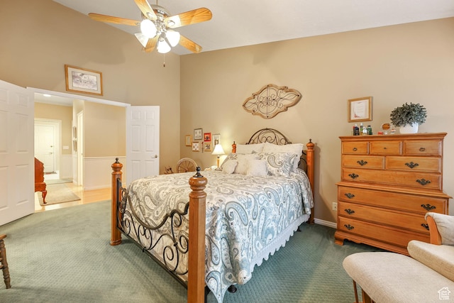 bedroom with a ceiling fan and carpet floors
