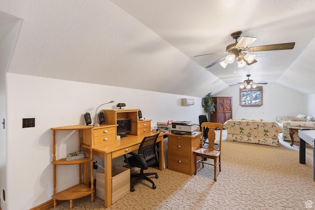 office area with light carpet, ceiling fan, and vaulted ceiling