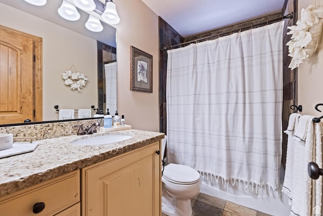 full bathroom with shower / tub combo with curtain, toilet, and vanity