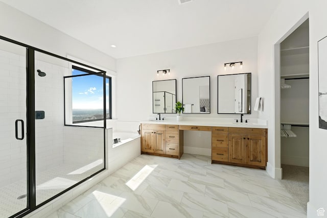 full bath featuring a sink, a stall shower, and a bath
