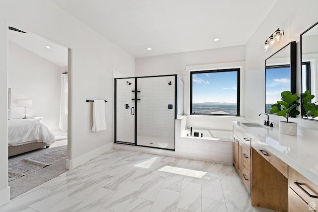 ensuite bathroom with vanity, recessed lighting, a shower stall, a bath, and marble finish floor