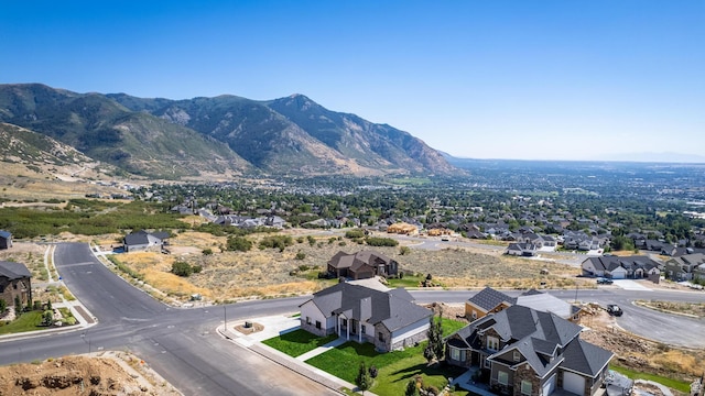 birds eye view of property featuring a mountain view and a residential view