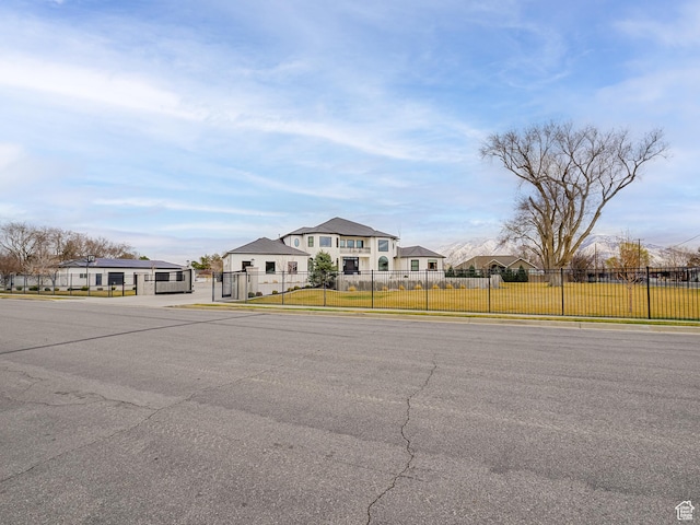 view of front facade with a front yard and fence