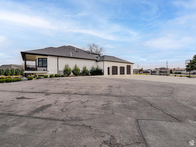 exterior space featuring an attached garage and concrete driveway