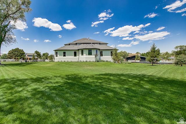 rear view of house with a lawn