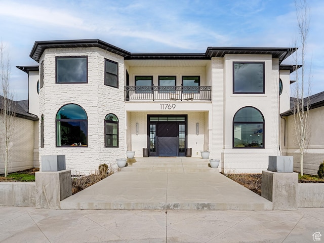 view of front of property with a balcony