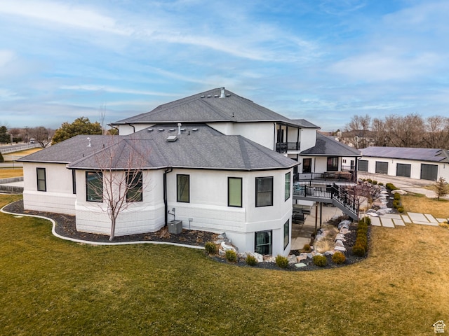 view of side of property with cooling unit, stucco siding, stairs, a shingled roof, and a lawn