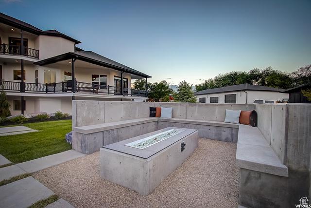 view of patio featuring a fenced backyard and a fire pit
