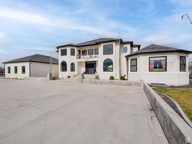 prairie-style home with a balcony