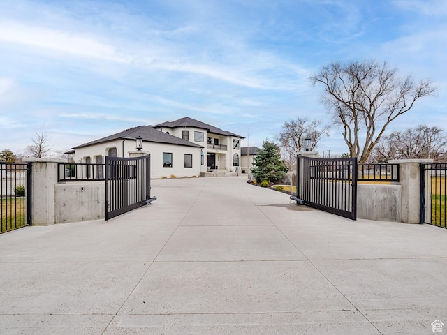 view of road featuring a gated entry, a gate, and driveway